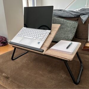 Foldable Lap Desk. Adjustable height and lays flat for storage.